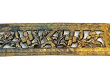 an image of a brass plate with flowers and leaves on it