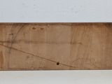 a wooden sign that is on a white table