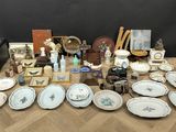many plates and bowls on the table with pictures