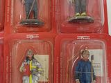 six different firemen figurines in the package