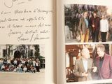 an open book with pictures of people on it