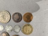 a lot of coins that are on the table