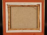 an old wooden easel with a picture frame on top of it