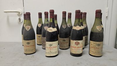 six bottles of wine are lined up in a row on a table