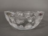 a glass bowl with a flower design on it