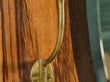 a close up of a door handle on a wooden door
