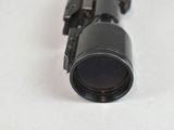 a close up of a gun on a white surface