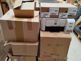 many boxes stacked on top of each other in a room