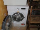 a washer and a dryer in a small room
