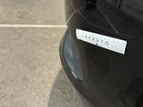 a sticker on the back of a black car