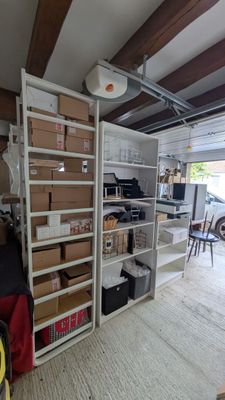 a garage with a lot of boxes and boxes on the shelves