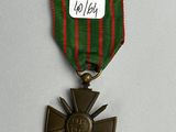 an image of a medal with a ribbon and a cross on it