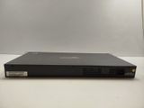 a close up of a dvd player sitting on a white surface