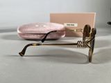 a pair of sunglasses sitting on a table next to a pink case
