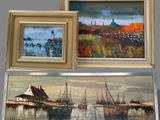 three framed paintings of boats in a harbor with a lighthouse in the background