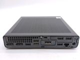the back view of a black laptop with two ports on it