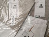 a lot of clothes that are wrapped up on the floor