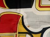 a picture of a red and yellow chair on a white background