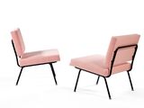 two pink chairs with black legs and a pink upholstered chair