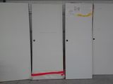 four white refrigerators sitting in a room next to each other