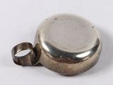 a silver ring sitting on top of a silver object