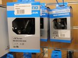 two boxes of earphones hanging on a rack in a store