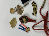 a lot of badges and other items that are on the table