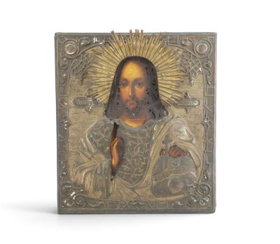 an image of a metal plaque with a picture of jesus on it