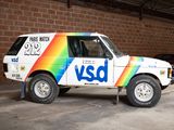 a white van with a rainbow painted on the side of it
