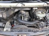 a picture of a car engine with its hood open