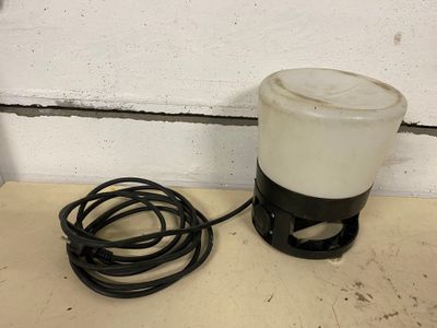a white and black blender sitting on a counter