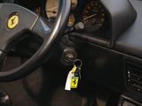 a steering wheel and dashboard of a car with a yellow tag on it