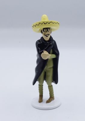 toy figurine of a mexican man with a sombren on his head