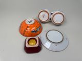 a small bowl, tea cup, and saucer sitting on a table