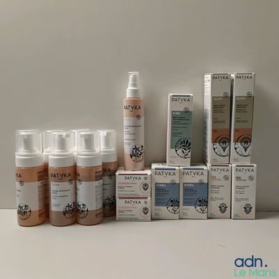 many different types of skin care products sitting on a table