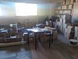 a room that has a lot of boxes and boxes on the floor