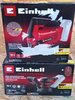two boxes of electric sanders sitting on top of each other