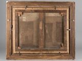 an old wooden window with a glass pane on the outside
