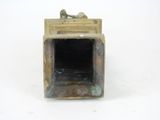 a statue of a man sitting in a small box