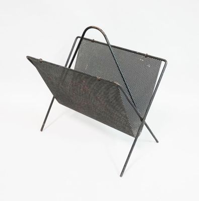 an image of a metal magazine rack on a white background