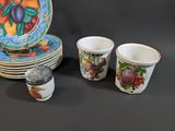 a lot of plates and cups sitting on a table