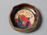 a small bowl with a picture of a man on it