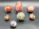 a lot of different types of marbles on a table