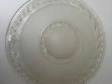a glass bowl on a table with a white background