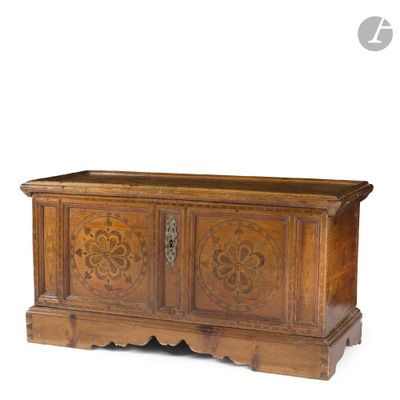 an old wooden chest with carvings on the front and sides