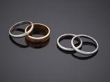three different rings are shown on a black surface