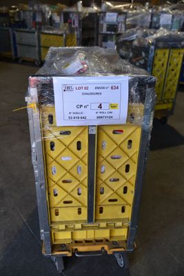 a cart that has a sign on it in a warehouse
