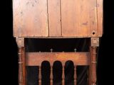 an old wooden writing desk with three legs and a wooden top