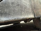 a close up view of a dirty car ' s bumper
