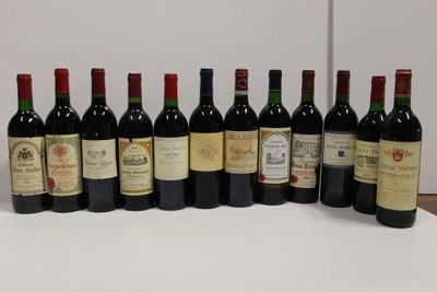 several bottles of wine are lined up on a table
